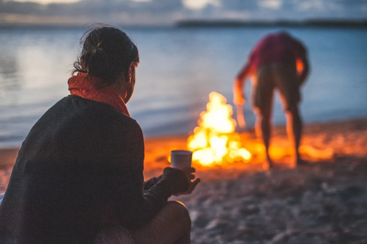 fire at the beach with coffee